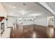 Spacious living room with hardwood floors, fireplace, and an open layout connecting to the kitchen at 2988 Chipmunk Se Trl, Marietta, GA 30067