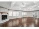 Spacious living room features hardwood floors, a fireplace, tray ceiling, and plenty of natural light at 2988 Chipmunk Se Trl, Marietta, GA 30067