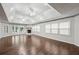 Bright, open living area with hardwood floors, fireplace, and multiple windows for lots of natural light at 2988 Chipmunk Se Trl, Marietta, GA 30067