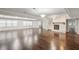 Expansive living room with hardwood floors, fireplace, and large windows providing plenty of natural light at 2988 Chipmunk Se Trl, Marietta, GA 30067