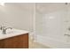 Well-lit bathroom featuring a bathtub with shower and a vanity with sink and chrome faucet at 625 Lorimore Pass, Canton, GA 30115