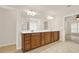 Bright Primary bath features double sinks with wood cabinets and tile flooring at 625 Lorimore Pass, Canton, GA 30115