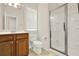 Bright bathroom featuring a glass-door shower, vanity, and natural light at 625 Lorimore Pass, Canton, GA 30115