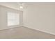 A view of a bedroom featuring carpet, a window with blinds and neutral paint at 625 Lorimore Pass, Canton, GA 30115