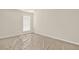 A view of a bedroom featuring carpet with plastic covering, window with blinds and neutral paint at 625 Lorimore Pass, Canton, GA 30115