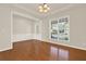 Hardwood floors enhance the open dining area featuring a tray ceiling and bright natural light at 625 Lorimore Pass, Canton, GA 30115