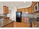 Well-lit kitchen with granite countertops, stainless steel appliances, and hardwood floors at 625 Lorimore Pass, Canton, GA 30115