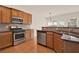 Kitchen featuring granite countertops, stainless steel appliances, and beautiful wood cabinets at 625 Lorimore Pass, Canton, GA 30115