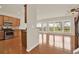 Open concept kitchen and living area with hardwood floors and an abundance of natural light at 625 Lorimore Pass, Canton, GA 30115
