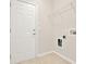 Functional laundry room with tile flooring and access to exterior at 625 Lorimore Pass, Canton, GA 30115