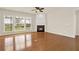 Cozy living room with fireplace, large windows, and wood floors at 625 Lorimore Pass, Canton, GA 30115