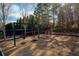 A park swing set surrounded by tall trees in a well-maintained area at 625 Lorimore Pass, Canton, GA 30115