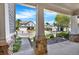Front porch view with stone columns and a landscaped yard in a suburban neighborhood at 625 Lorimore Pass, Canton, GA 30115