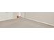 A view of a room with carpet and two doors, showing a neutral color palette at 625 Lorimore Pass, Canton, GA 30115