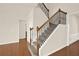 Elegant staircase with wooden railing and carpeted steps at 625 Lorimore Pass, Canton, GA 30115