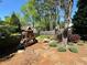Backyard featuring a wooden playset, mulch, and a well-maintained wooden privacy fence at 680 Estate Club Cir, Roswell, GA 30075