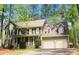 Inviting two-story home with a covered front porch, dormer windows, and an attached two-car garage at 863 Fairwood Pointe Nw, Acworth, GA 30101