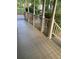 Spacious front porch with painted wood flooring and railing offers an inviting outdoor space at 863 Fairwood Pointe Nw, Acworth, GA 30101