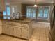 Bright kitchen with granite countertops, tiled floor, an island, and stainless steel appliances at 863 Fairwood Pointe Nw, Acworth, GA 30101