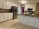 Updated kitchen featuring granite countertops, stainless steel appliances, and ample white cabinetry at 863 Fairwood Pointe Nw, Acworth, GA 30101