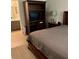 Inviting bedroom with elegant furniture, a cozy bed, and a peek into the adjoining bathroom, offering comfort and convenience at 1504 Augusta Se Dr, Marietta, GA 30067