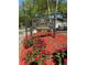 St. Augustine Place community entrance sign surrounded by lush landscaping and colorful flowers at 1504 Augusta Se Dr, Marietta, GA 30067