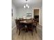Dining room features wood floors, a round table, four chairs, and modern lighting at 1504 Augusta Se Dr, Marietta, GA 30067