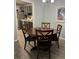 Dining room features wood floors, a round table, four chairs, and modern lighting at 1504 Augusta Se Dr, Marietta, GA 30067