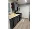 Kitchen featuring stainless steel appliances, modern cabinets, and laminate floors at 1504 Augusta Se Dr, Marietta, GA 30067
