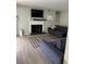 Cozy living room with modern furniture, fireplace, and sleek hardwood flooring at 1504 Augusta Se Dr, Marietta, GA 30067