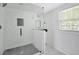 Modern bathroom featuring a glass shower with stylish white herringbone tile and sleek fixtures at 1728 Line St, Decatur, GA 30032