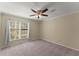 Comfortable bedroom with neutral carpet and a bright window, creating a cozy and inviting space at 208 Bainbridge Dr, Atlanta, GA 30327