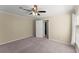 This carpeted bedroom features neutral walls, ceiling fan and a closet at 208 Bainbridge Dr, Atlanta, GA 30327