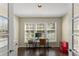 Bright home office space with ample windows, perfect for remote work or study, featuring hardwood floors at 208 Bainbridge Dr, Atlanta, GA 30327