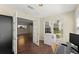 Functional home office with natural light, hardwood floors, and convenient access to adjacent living area at 208 Bainbridge Dr, Atlanta, GA 30327