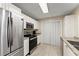 Well-equipped kitchen featuring stainless steel appliances, granite countertops, and ample cabinet space at 208 Bainbridge Dr, Atlanta, GA 30327