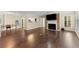 Open living space features hardwood floors, fireplace and a seamless connection to kitchen at 208 Bainbridge Dr, Atlanta, GA 30327