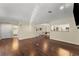 Expansive living room with rich hardwood floors and an open layout to kitchen at 208 Bainbridge Dr, Atlanta, GA 30327