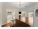 Inviting living area with hardwood floors, fireplace, and abundant natural light, connecting seamlessly to other rooms at 208 Bainbridge Dr, Atlanta, GA 30327