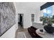 Bright hallway area with stylish seating, elegant artwork, and a view into the adjacent room at 946 Hughley Circle # 98, Atlanta, GA 30316