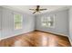 Inviting bedroom with hardwood floors, neutral walls, and bright natural light from the large windows at , Tucker, GA 30084