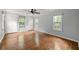 Primary bedroom features hardwood floors, large windows, and built in wardrobes at , Tucker, GA 30084