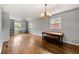 Open dining area with hardwood floors, custom shelving, and natural light at , Tucker, GA 30084