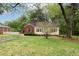 Charming home showcasing a lush front yard and a brick and siding exterior at , Tucker, GA 30084