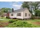 Charming home featuring light siding, dark shutters, and a well-maintained front yard at , Tucker, GA 30084