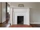 Close-up of a charming fireplace with white mantle and brick surround at , Tucker, GA 30084