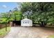 Detached garage with basketball hoop, storage shed, and ample space for parking at , Tucker, GA 30084