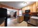 Functional kitchen featuring light wood cabinets, black appliances, and tile flooring at , Tucker, GA 30084