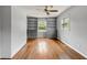 Neutral living room featuring hardwood floors and custom built-in shelving at , Tucker, GA 30084