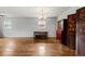 Spacious living room with hardwood floors, large windows, and elegant chandelier at , Tucker, GA 30084
